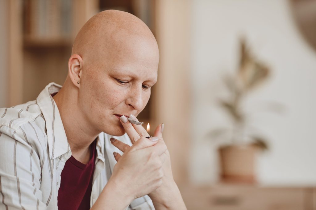 bald women smoking marijuana